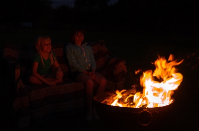 Family sitting by the fire pit